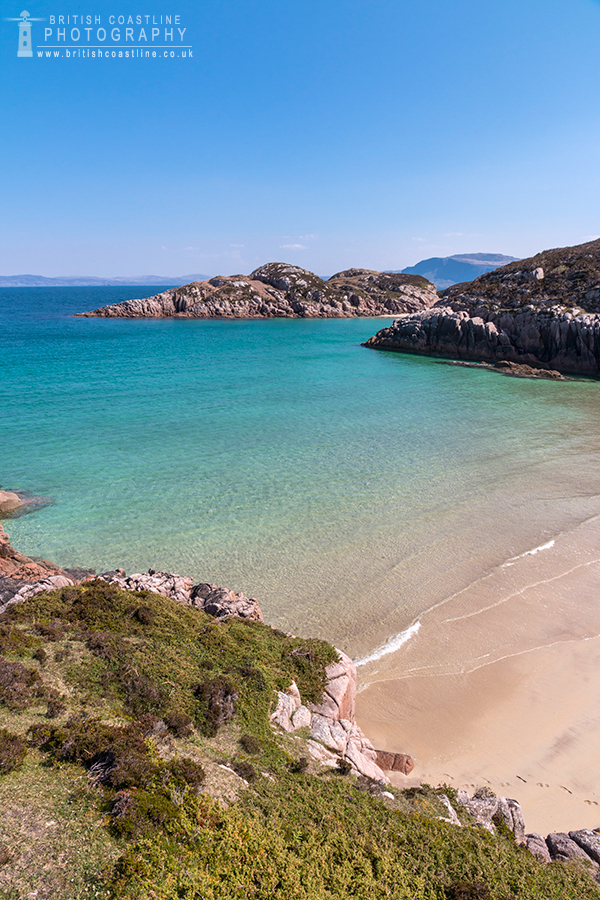 Market Bat, Isle of Mull, grassy foreground, golden sandy beach, tropical waters, clear blue skies